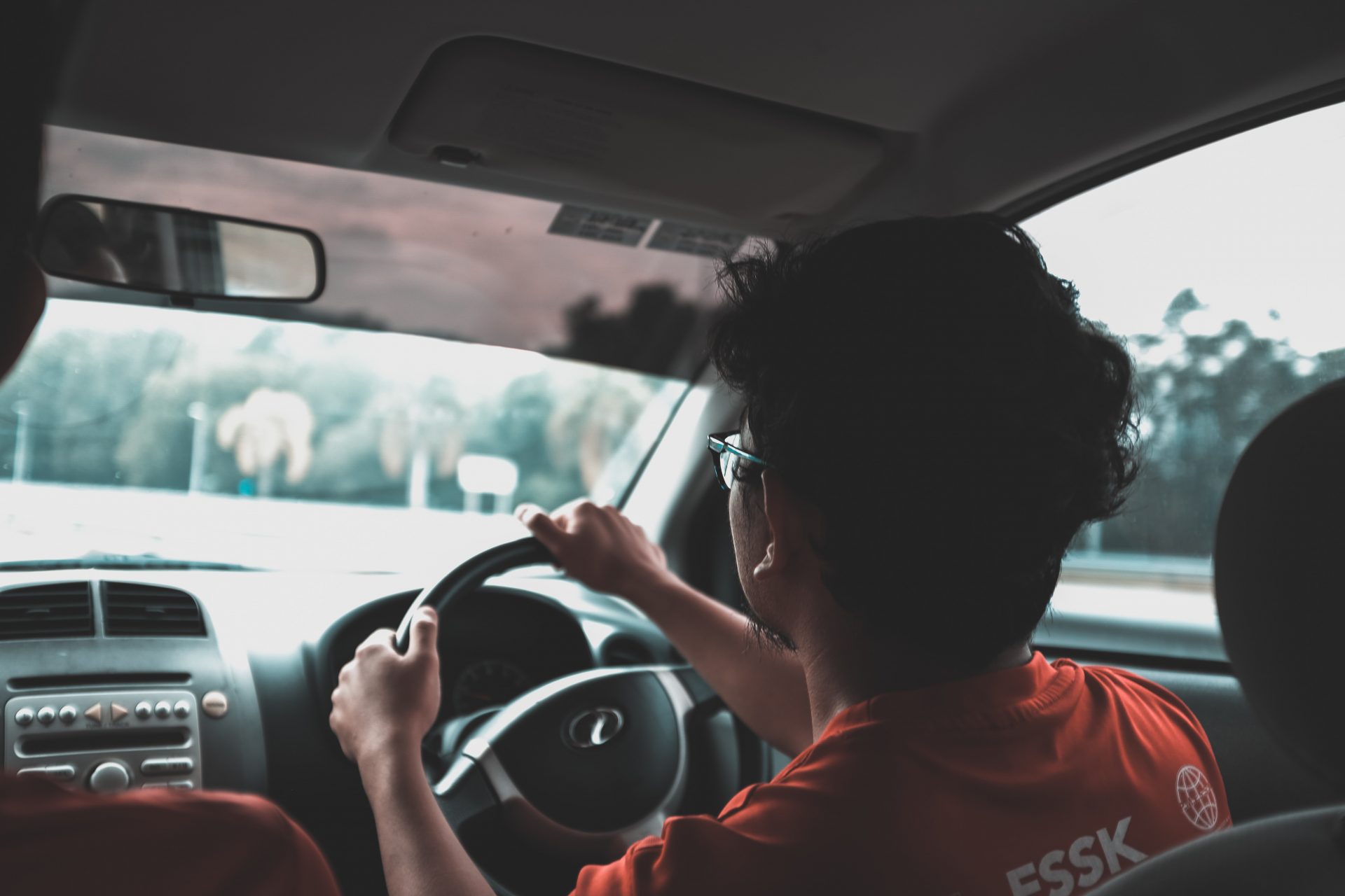 young man driving car